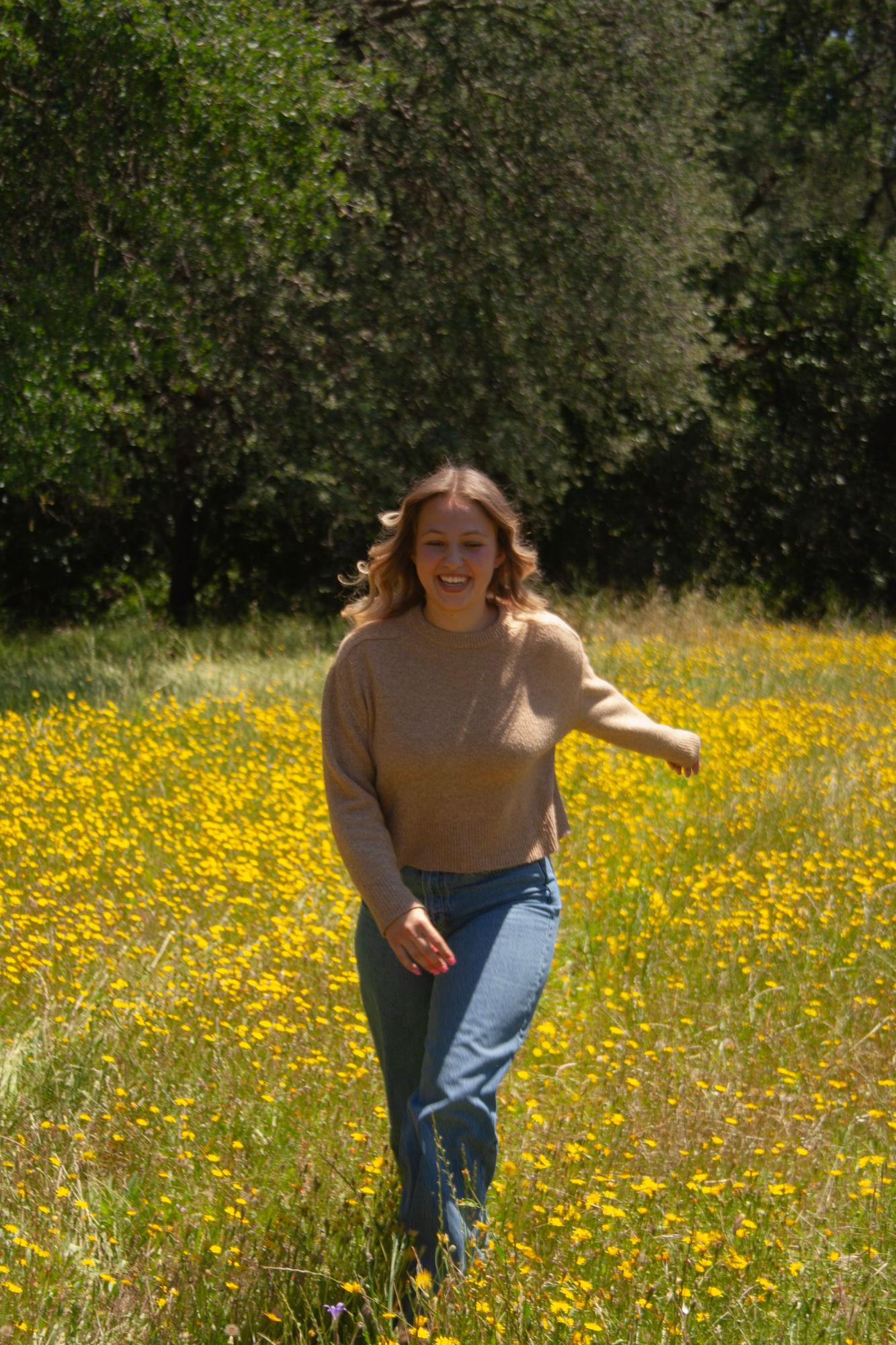 Senior girl laughing in a wildflower field — Sacramento senior portrait photographer